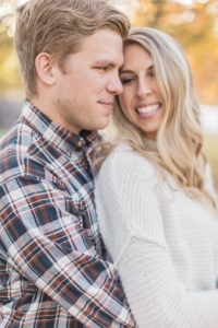 couple laughing during fall photoshoot