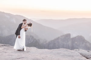 Groom dips Bride and laughs at sunset in Yosemite California