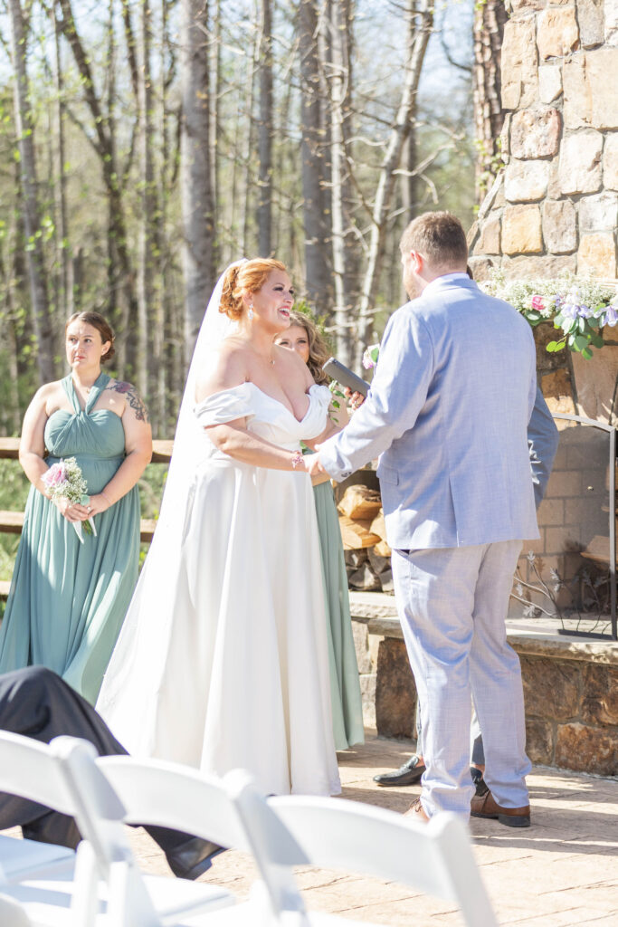 Couple getting married in front of Lavender Oaks Farm chimney