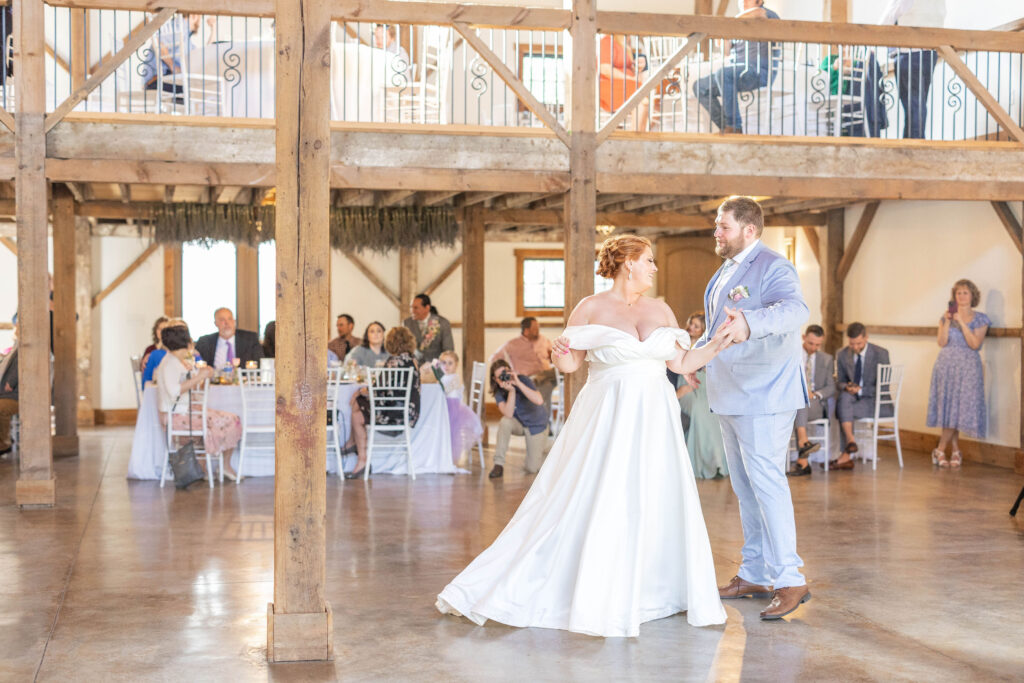 bride and groom dance in Lavender Oaks Farms main barn